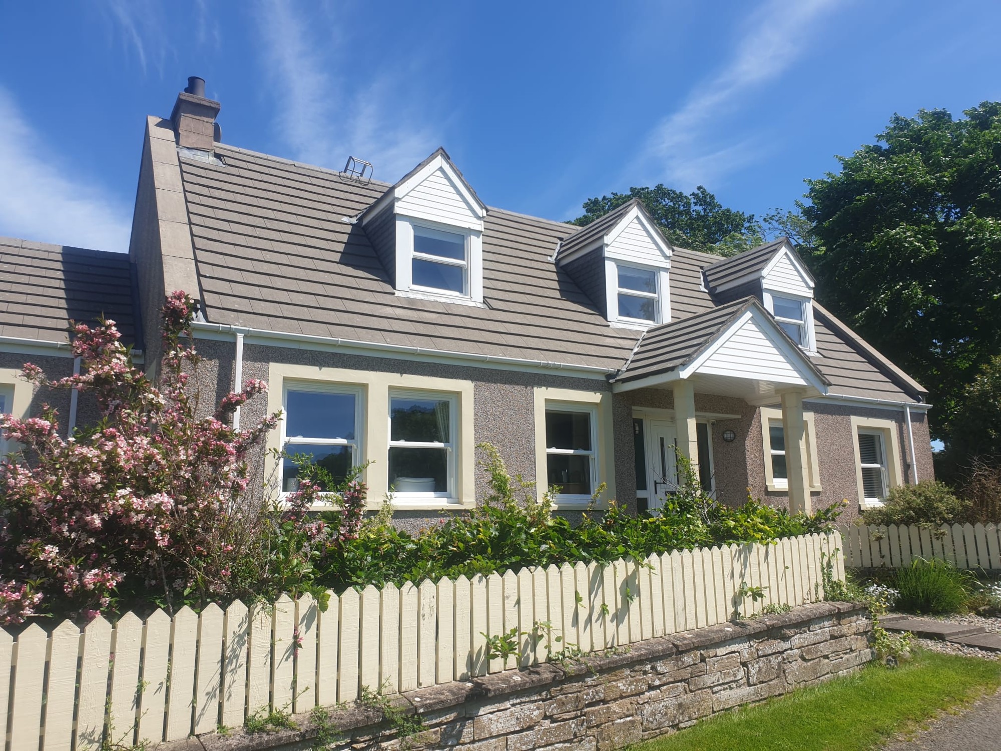 Roof after professional moss removal and cleaning — spotless restored tiles on Perthshire property
