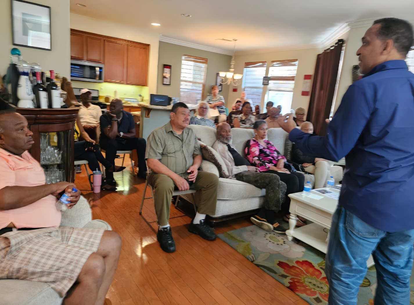 Tony Waite leading a home wellness gathering