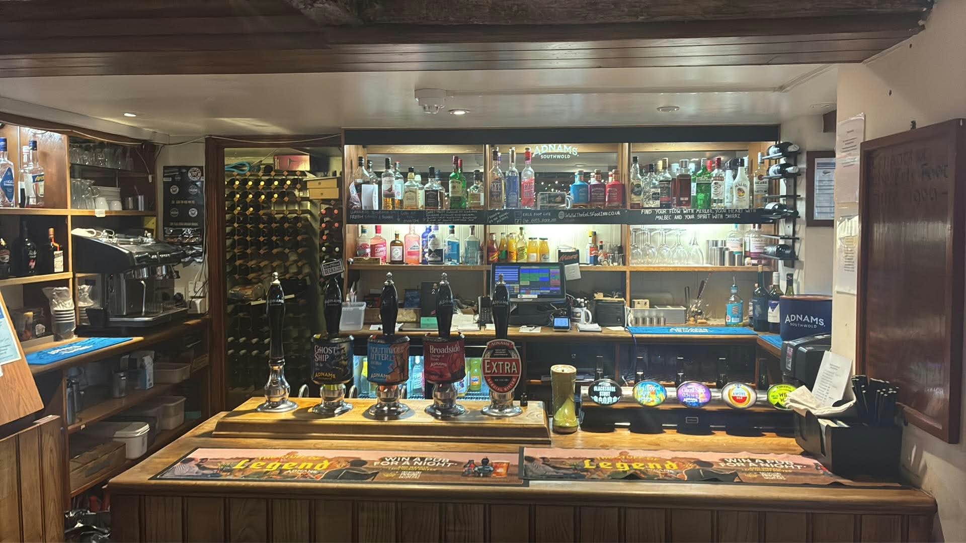 The bar at the Eel’s Foot Inn, with Adnams ales on the handpulls