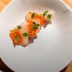 Chef plating multiple dishes