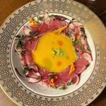 Artistic food presentation on pink plate