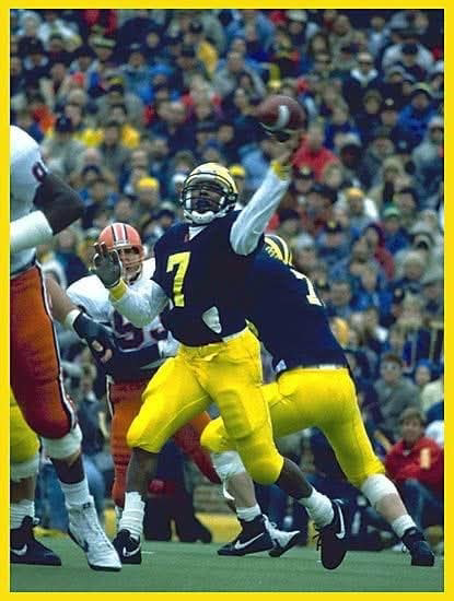 Demetrius Brown #7 throwing a pass at Michigan