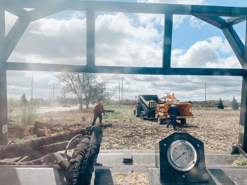 Lot clearing crew working with heavy equipment