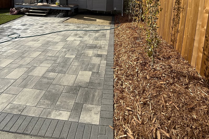 Clean paver patio and cedar fence showing professional property maintenance in Calgary