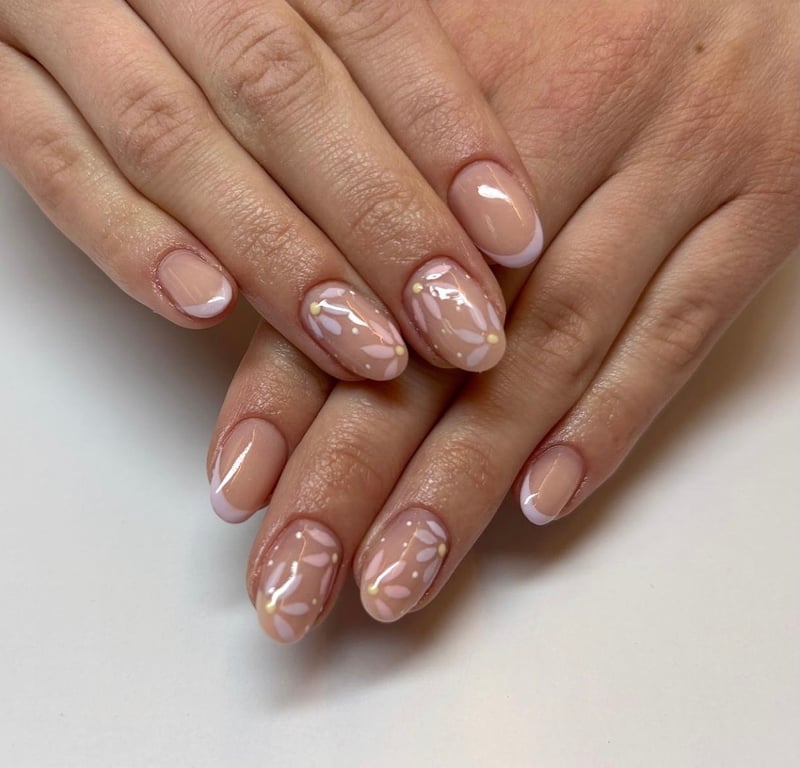 Nude nails with white flower art