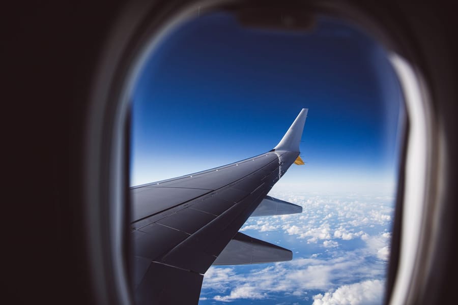 Clouds seen from an airplane window during a daytime flight