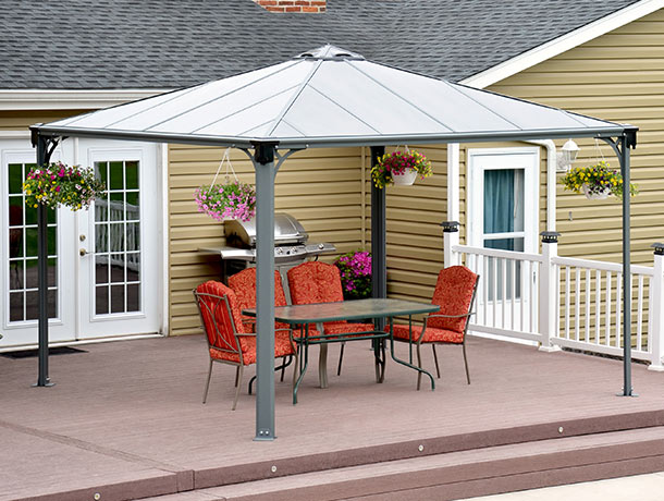 Aluminium gazebo with garden furniture on a patio