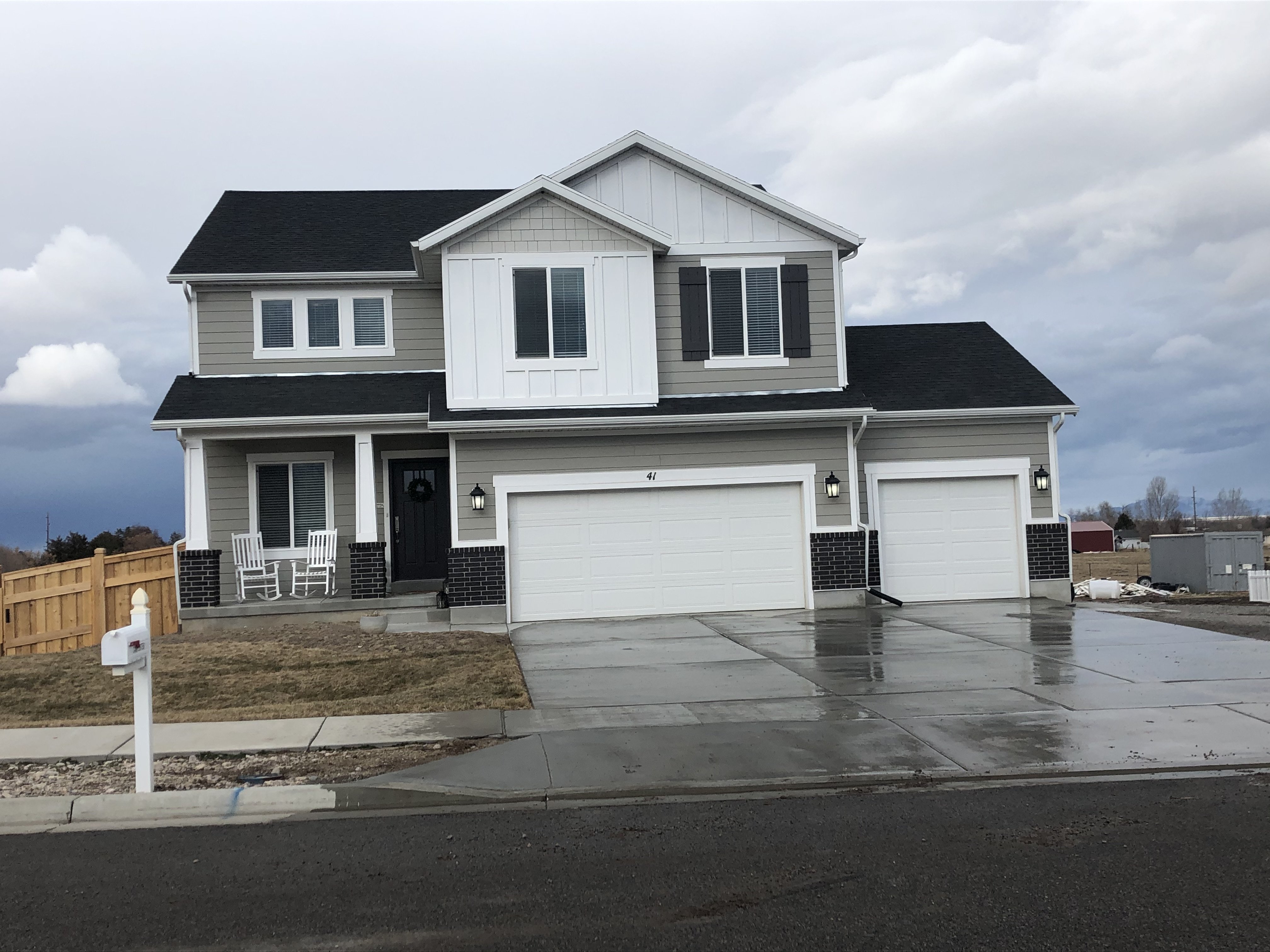 Completed custom farmhouse home — two-story, 3-car garage, B&N Construction Southern Idaho