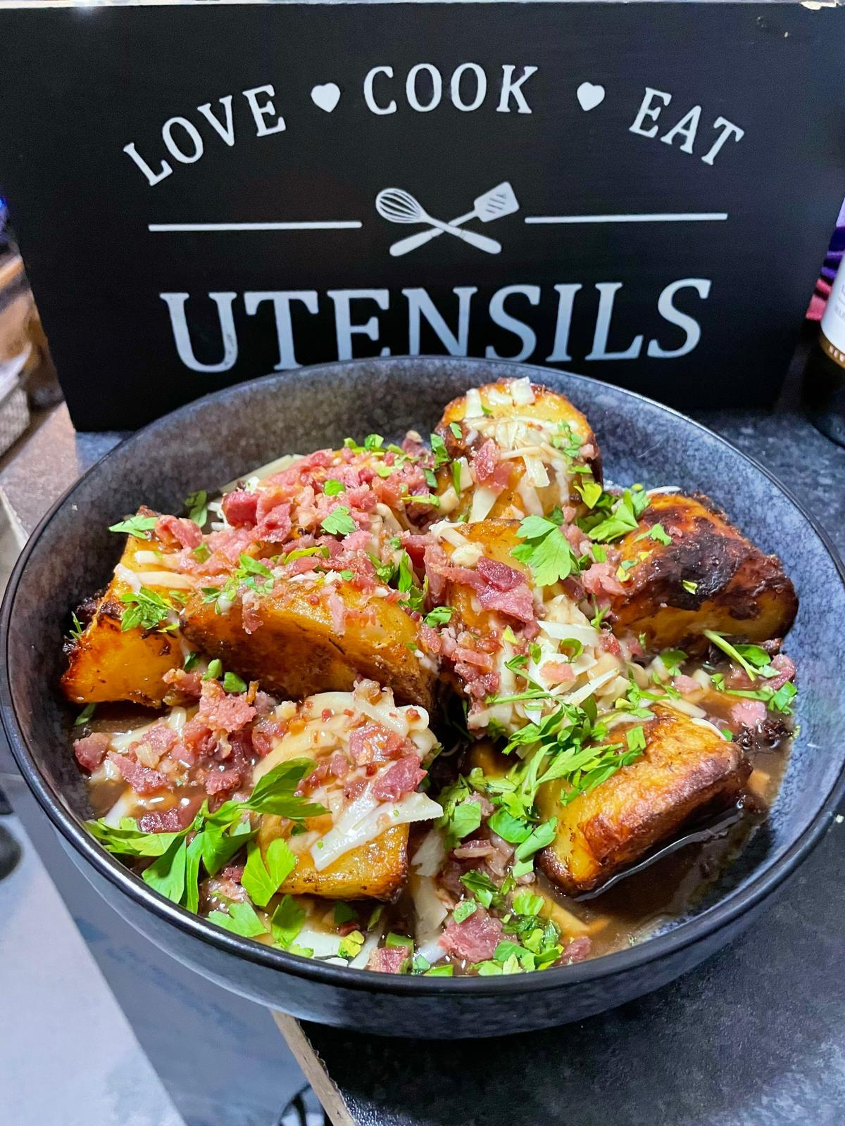 Loaded roast potatoes topped with bacon and parsley from the Star Inn kitchen