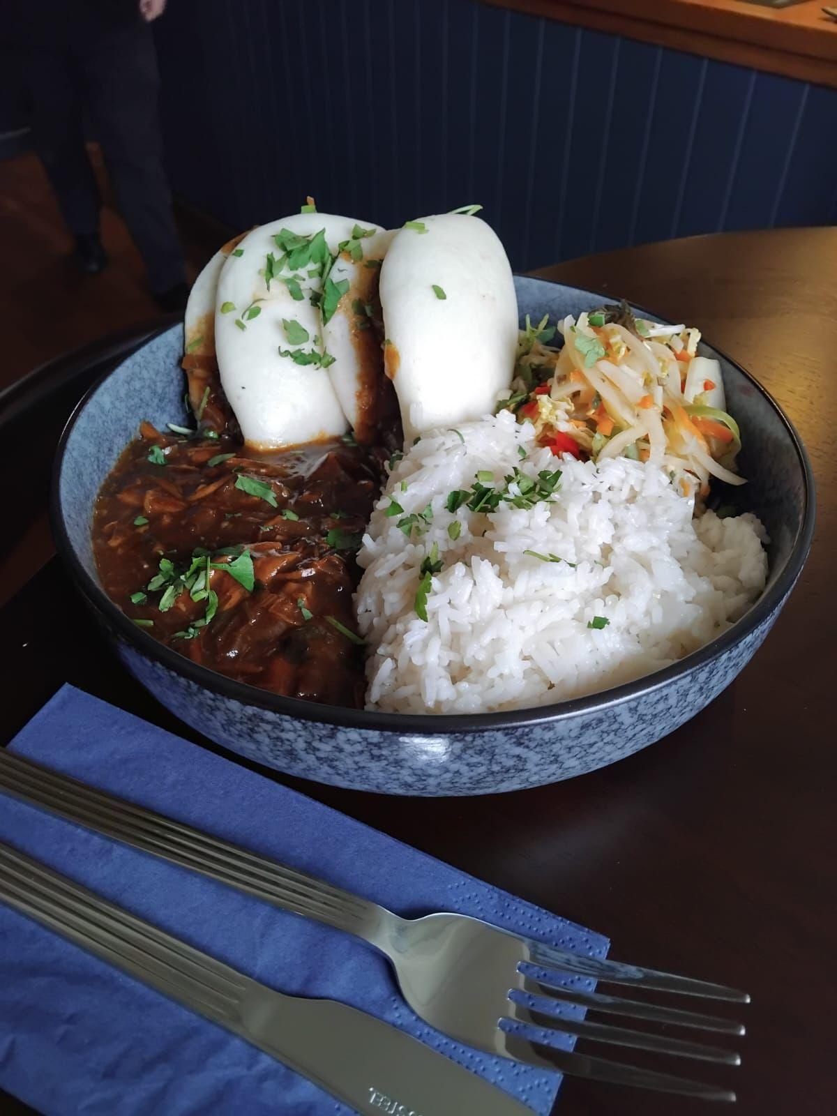 A bowl of steamed bao buns with rice and pickles from The Star Inn kitchen
