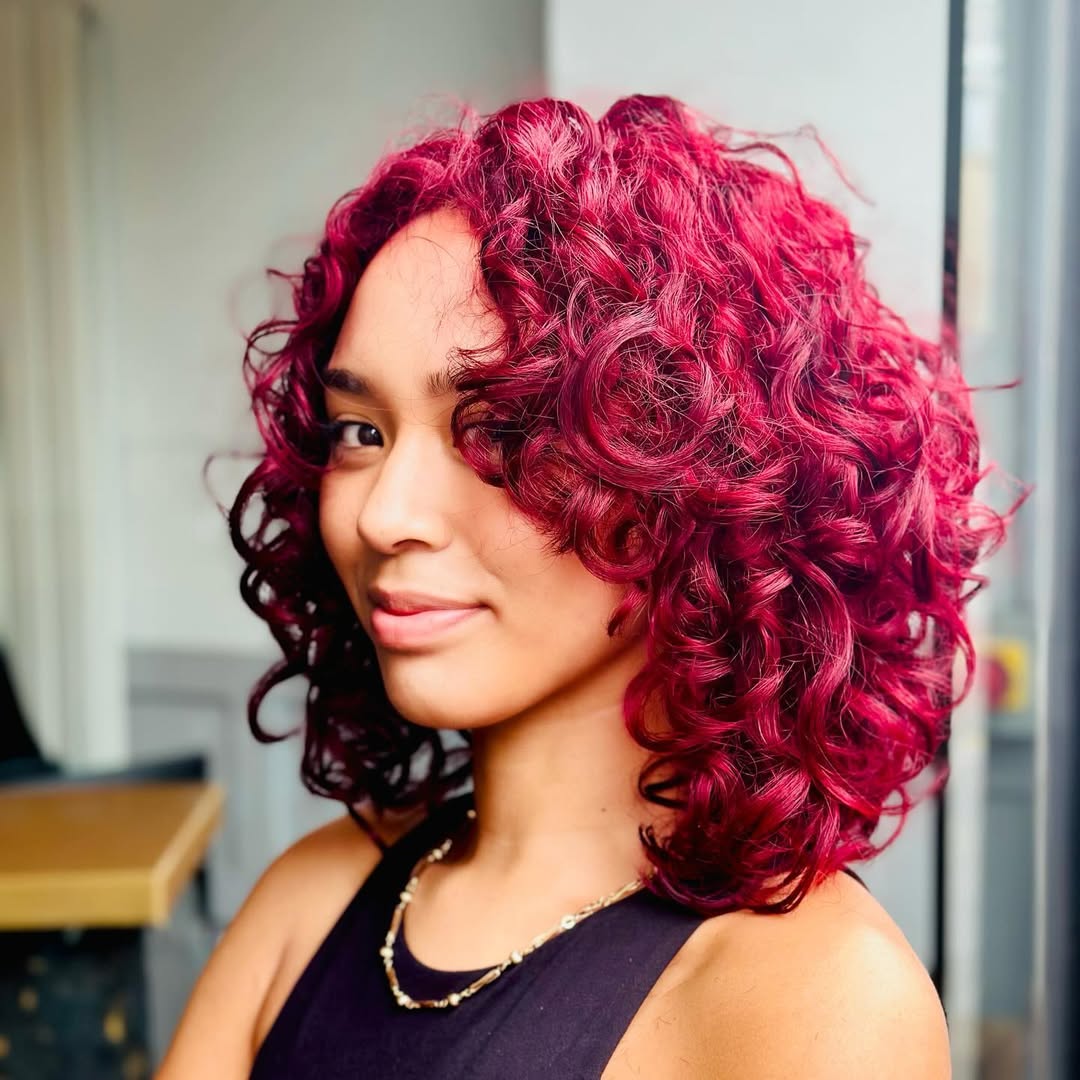 Bold magenta refreshed curls by Mya at 3thirty