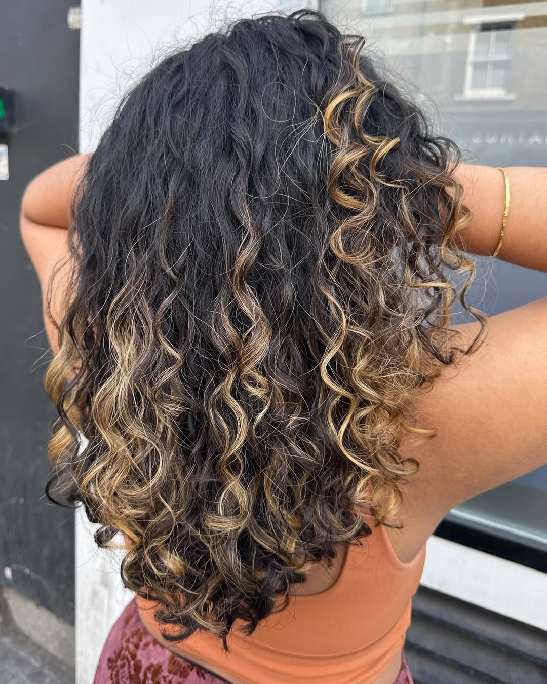 Bouncy highlighted curls at 3thirty Salon