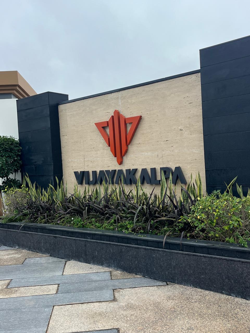 Dimensional cut-letter signage on stone and ACP cladding
