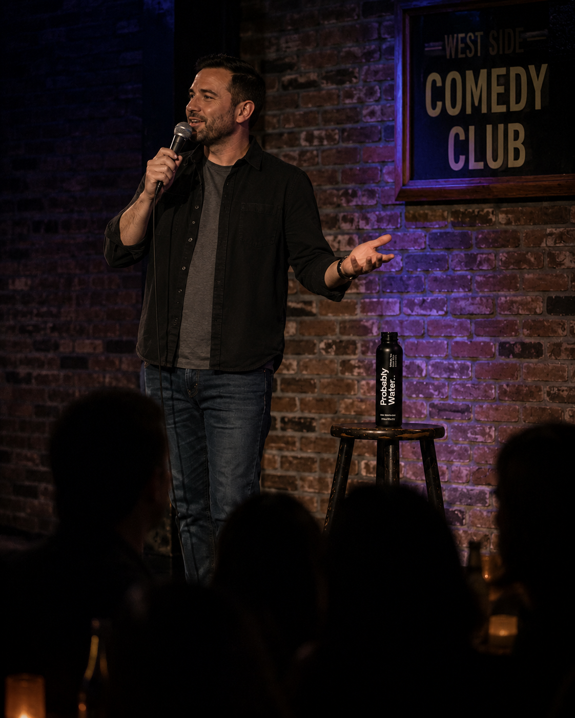 Probably Water bottle on a comedy club stage table