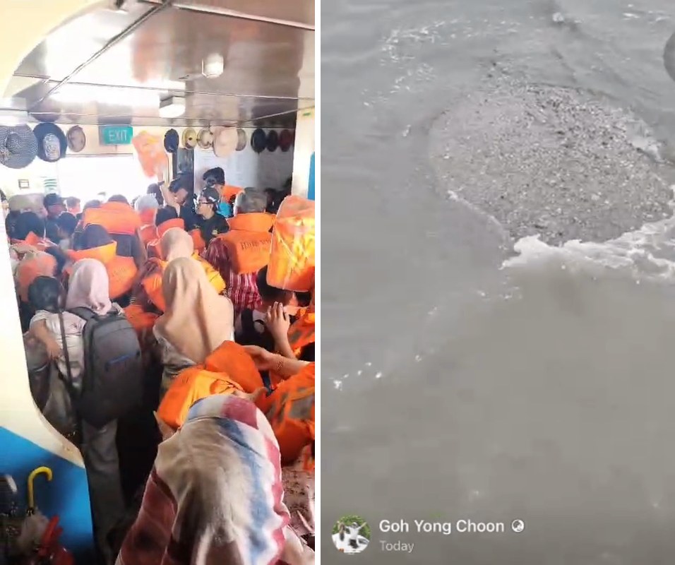 Passengers in life jackets crowded in the ferry cabin, and a sandbank showing at the water surface