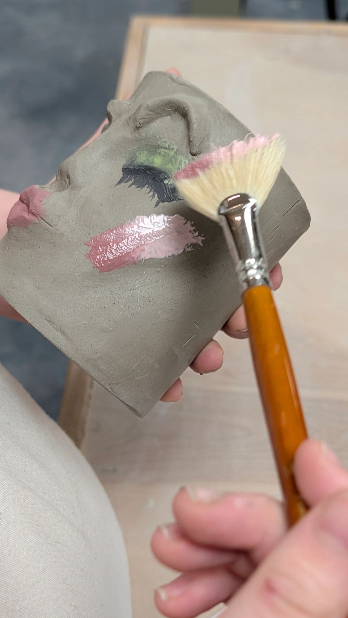Close-up of hands shaping clay on a pottery wheel