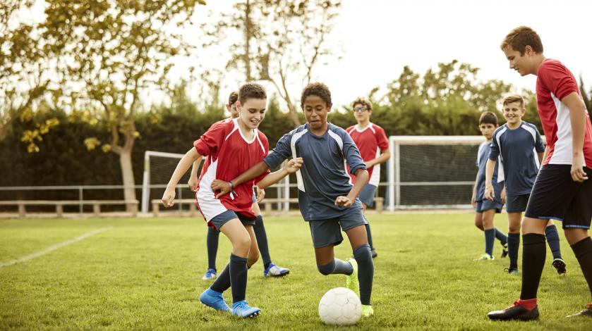 Kids playing soccer - sports physicals