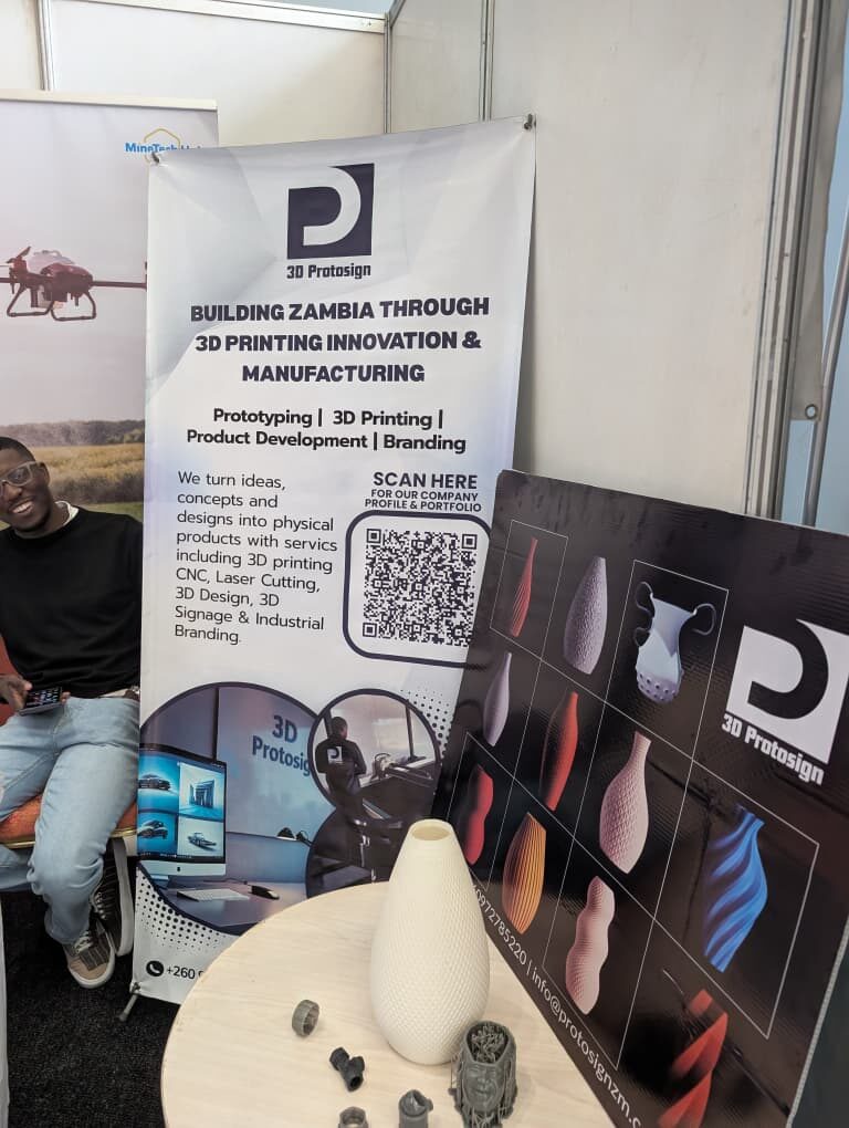 Close-up of the Protosign expo banner and 3D-printed vases