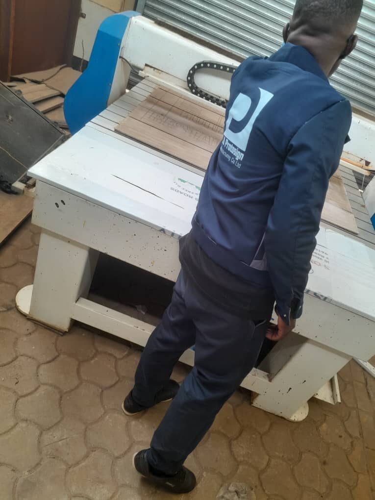 Operator running the CNC router in the Protosign workshop