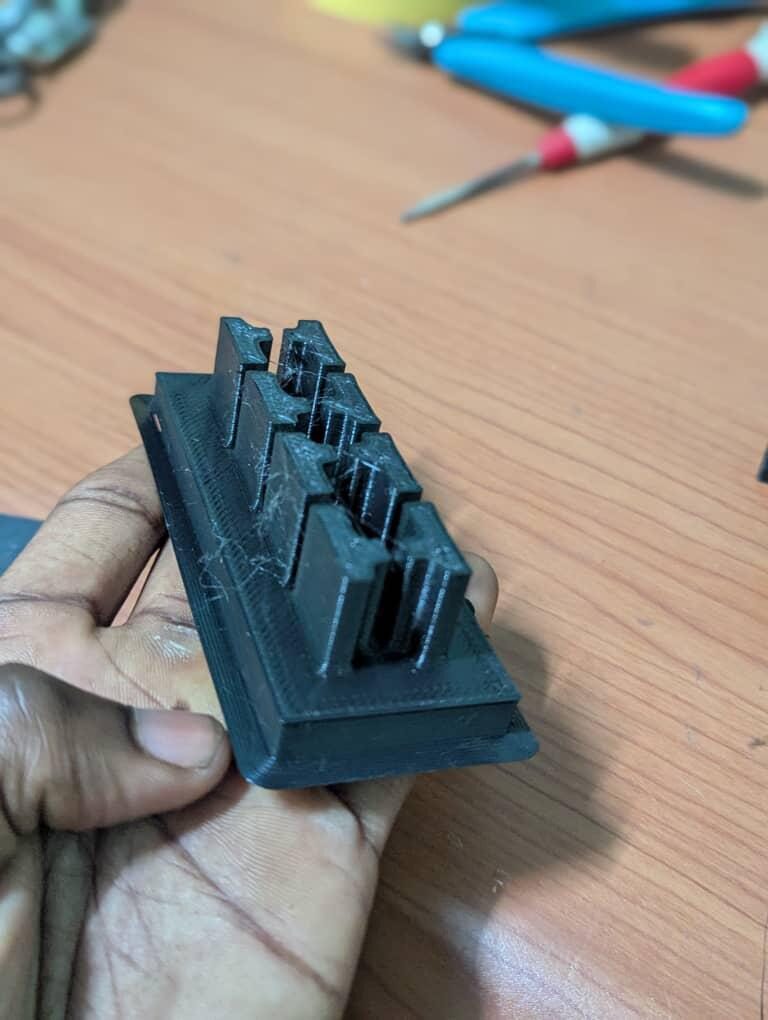 Single FDM 3D-printed part held in a hand