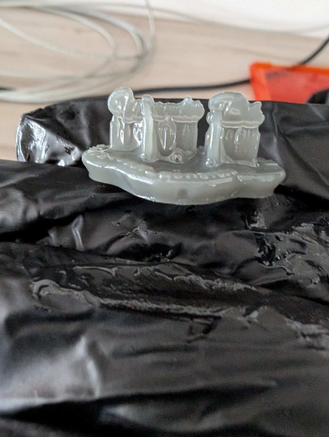 Resin SLA 3D print in progress on the build surface